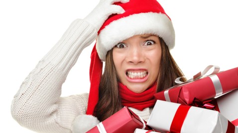 Christmas stress - busy woman wearing santa hat stressing for ch